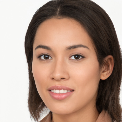 Joyful white young-adult female with long  brown hair and brown eyes