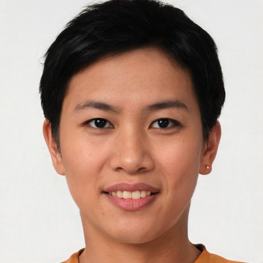 Joyful asian young-adult female with short  black hair and brown eyes