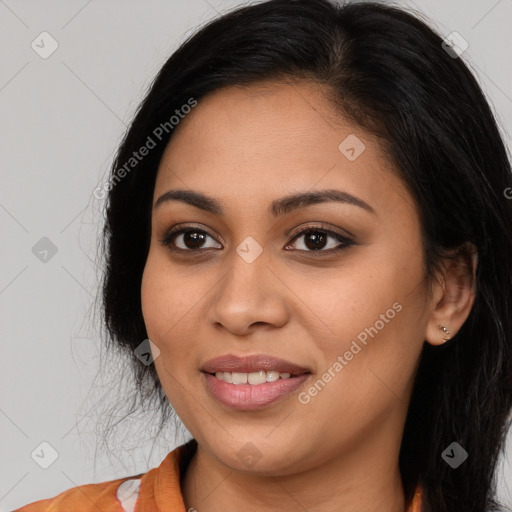 Joyful latino young-adult female with long  black hair and brown eyes