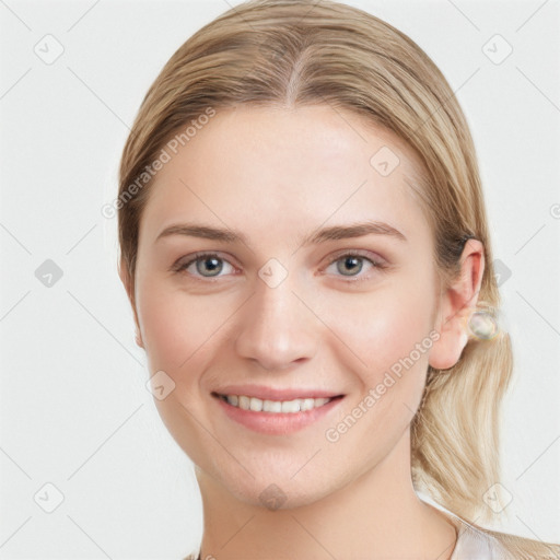 Joyful white young-adult female with long  brown hair and blue eyes