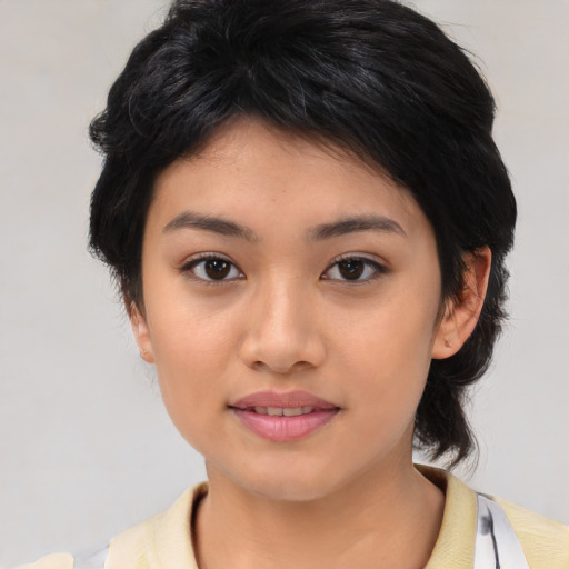 Joyful asian young-adult female with medium  black hair and brown eyes