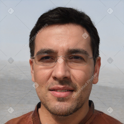 Joyful white adult male with short  black hair and brown eyes