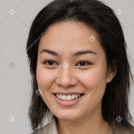 Joyful white young-adult female with long  brown hair and brown eyes