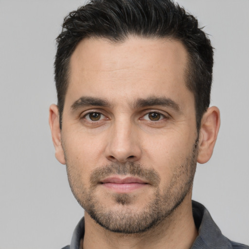 Neutral white young-adult male with short  black hair and brown eyes