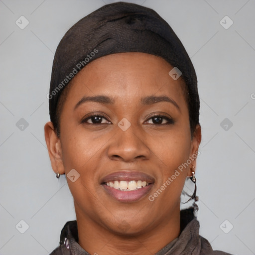 Joyful black young-adult female with short  black hair and brown eyes