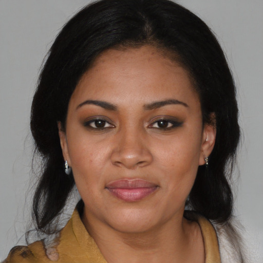 Joyful black young-adult female with medium  black hair and brown eyes
