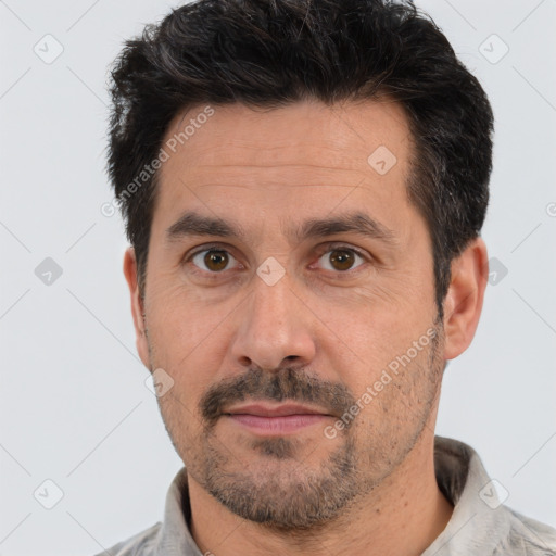 Neutral white adult male with short  black hair and brown eyes