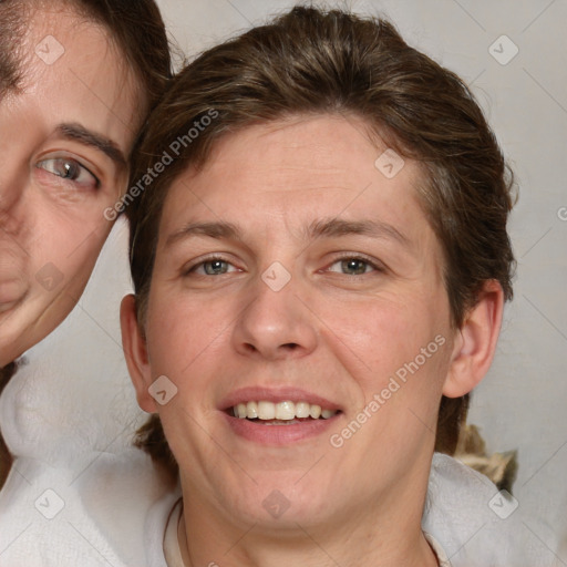 Joyful white adult male with medium  brown hair and brown eyes