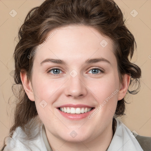 Joyful white young-adult female with medium  brown hair and green eyes