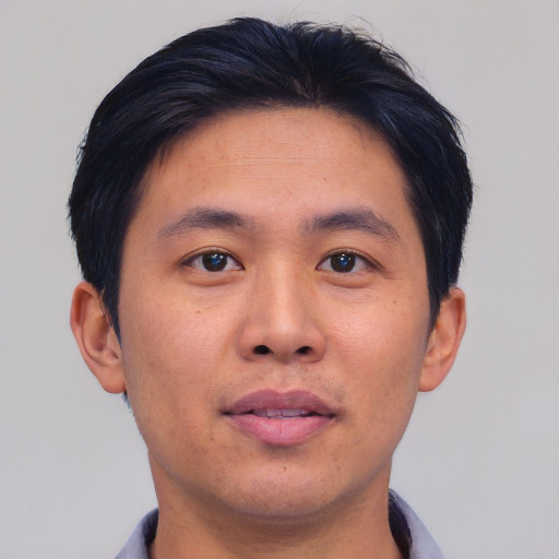 Neutral asian young-adult male with short  brown hair and brown eyes