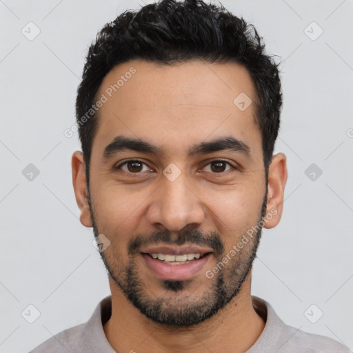 Joyful latino young-adult male with short  black hair and brown eyes