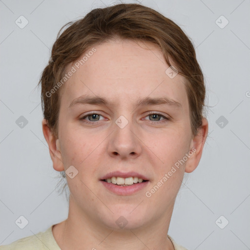 Joyful white young-adult female with short  brown hair and grey eyes