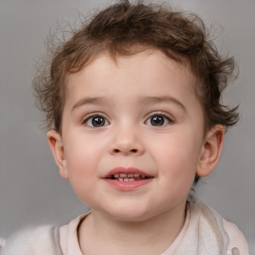 Joyful white child male with short  brown hair and brown eyes