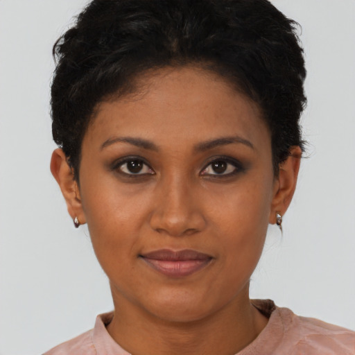 Joyful latino young-adult female with short  brown hair and brown eyes