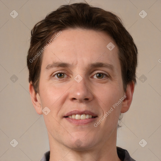 Joyful white adult male with short  brown hair and grey eyes