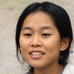 Joyful asian young-adult female with medium  black hair and brown eyes