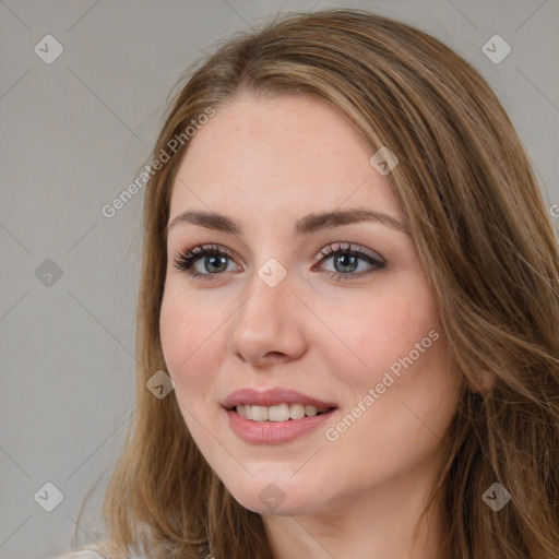 Joyful white young-adult female with long  brown hair and green eyes