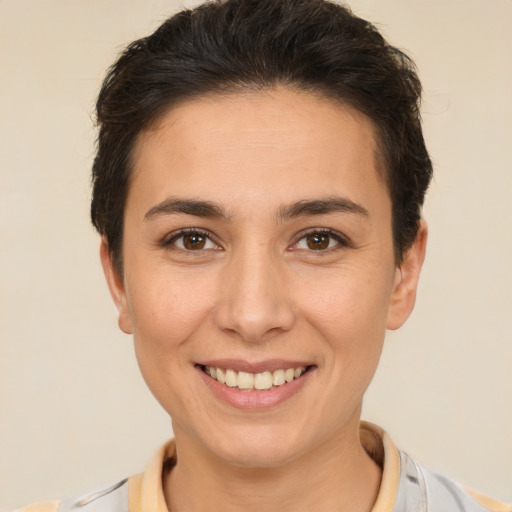 Joyful white young-adult female with short  brown hair and brown eyes