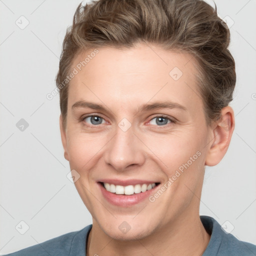 Joyful white young-adult female with short  brown hair and grey eyes