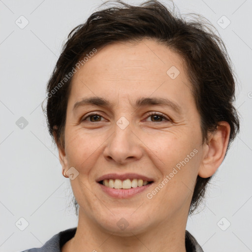 Joyful white adult female with short  brown hair and brown eyes