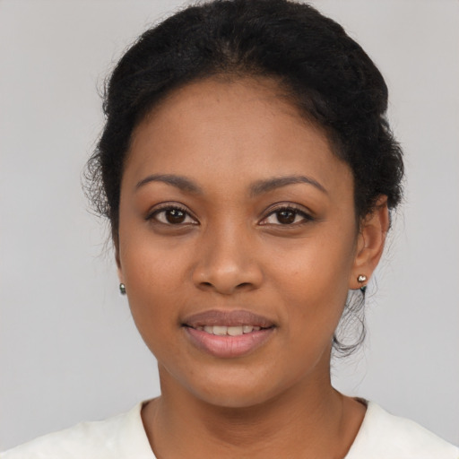 Joyful latino young-adult female with short  black hair and brown eyes