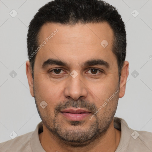 Joyful white adult male with short  brown hair and brown eyes