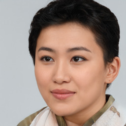 Joyful asian young-adult female with short  brown hair and brown eyes