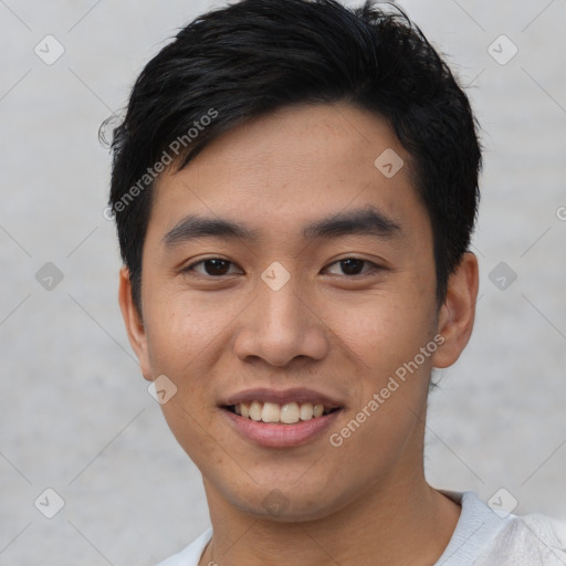 Joyful asian young-adult male with short  black hair and brown eyes