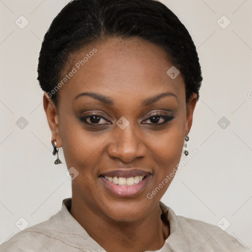 Joyful black young-adult female with short  black hair and brown eyes