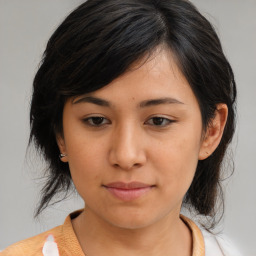 Joyful asian young-adult female with medium  brown hair and brown eyes