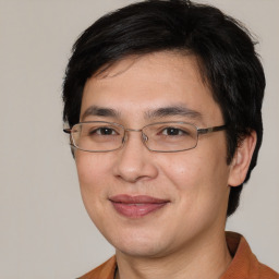 Joyful white adult male with medium  brown hair and brown eyes