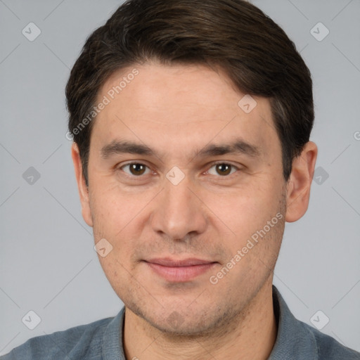 Joyful white adult male with short  brown hair and brown eyes