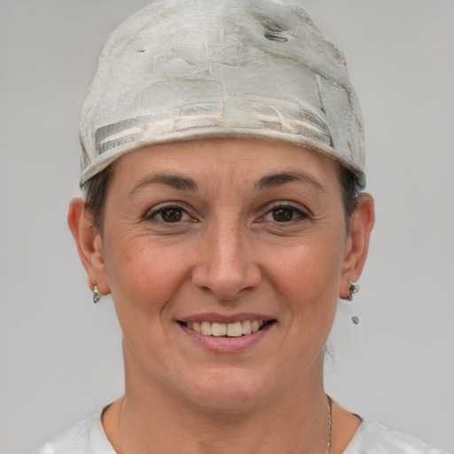 Joyful white adult female with short  gray hair and grey eyes