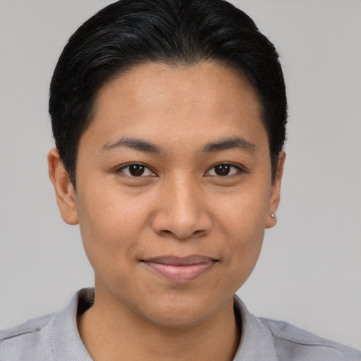 Joyful asian young-adult female with short  black hair and brown eyes
