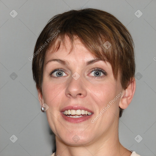 Joyful white adult female with medium  brown hair and blue eyes