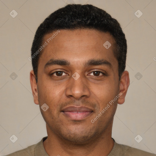 Joyful black young-adult male with short  black hair and brown eyes