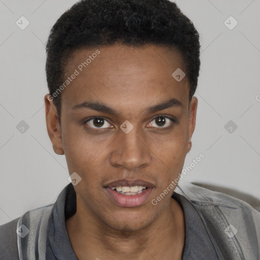 Joyful black young-adult male with short  black hair and brown eyes