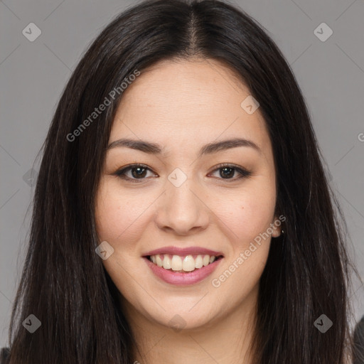 Joyful asian young-adult female with long  brown hair and brown eyes