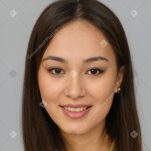 Joyful latino young-adult female with long  brown hair and brown eyes