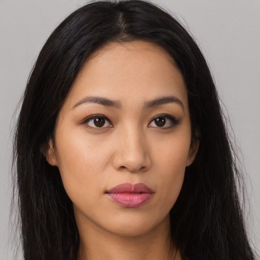 Neutral latino young-adult female with long  black hair and brown eyes
