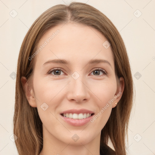 Joyful white young-adult female with long  brown hair and grey eyes