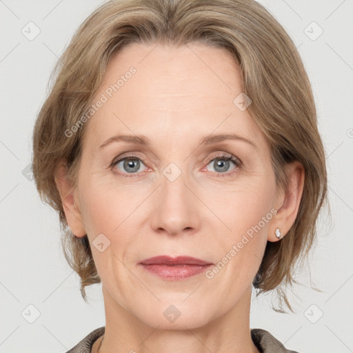 Joyful white adult female with medium  brown hair and grey eyes