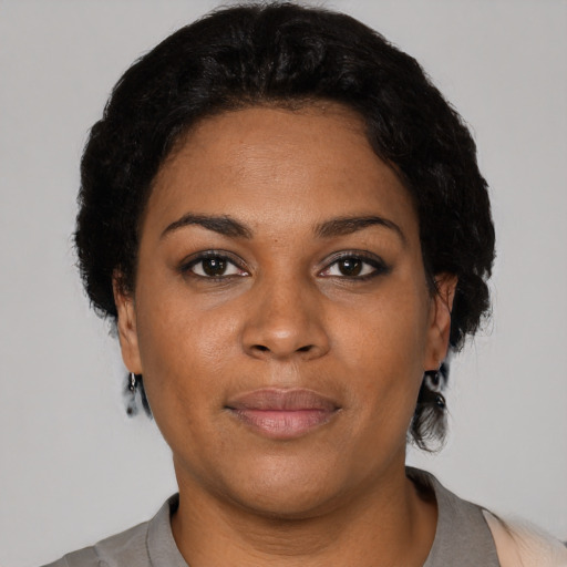 Neutral black young-adult female with short  black hair and brown eyes