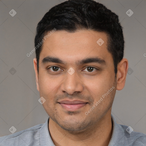 Joyful latino young-adult male with short  black hair and brown eyes