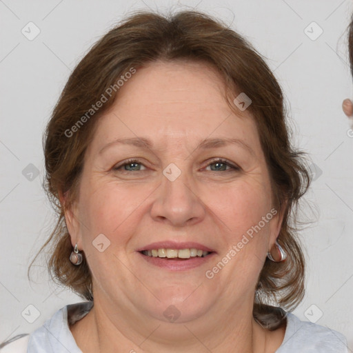 Joyful white adult female with medium  brown hair and brown eyes