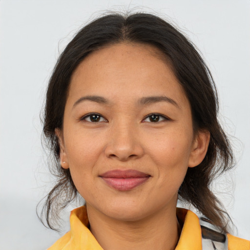 Joyful asian young-adult female with medium  brown hair and brown eyes