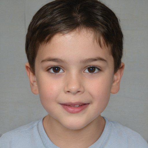 Joyful white child male with short  brown hair and brown eyes