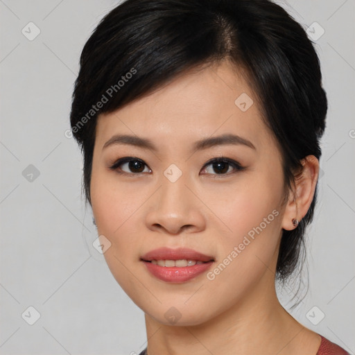 Joyful asian young-adult female with medium  black hair and brown eyes