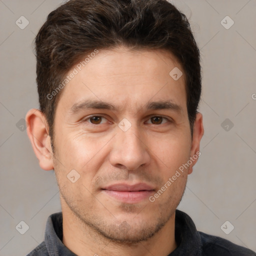 Joyful white adult male with short  brown hair and brown eyes