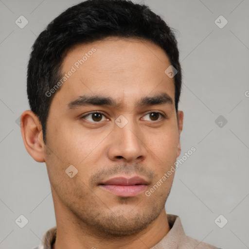 Neutral latino young-adult male with short  brown hair and brown eyes